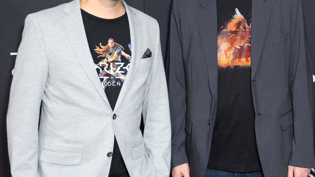 Two people wearing graphic tees and blazers at The Game Awards 2022