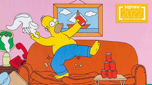 Homer Simpsons cheers and dances on top of his couch. 