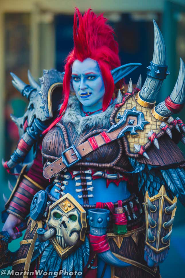 A troll cosplayer from BlizzCon 2023 furrows their brow. 