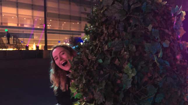 Emma Kent hides behind a bush.